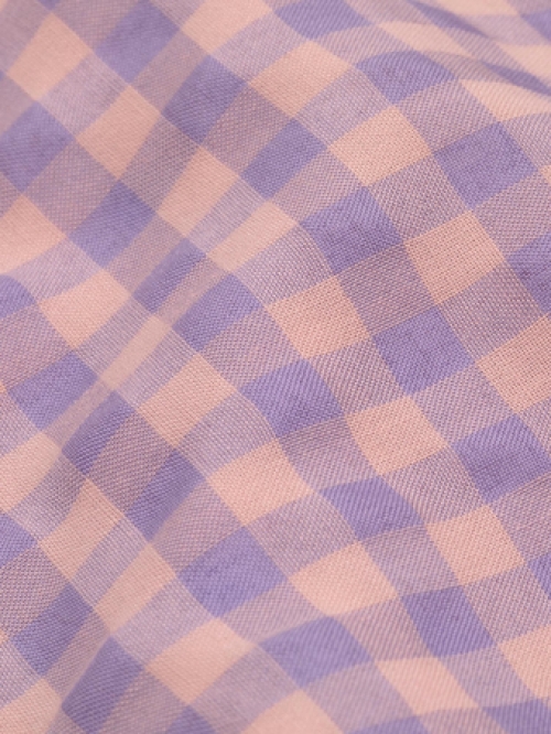 Close-up van Ydence Dress Erin Peach check met ruit print in de kleuren peach en lila.